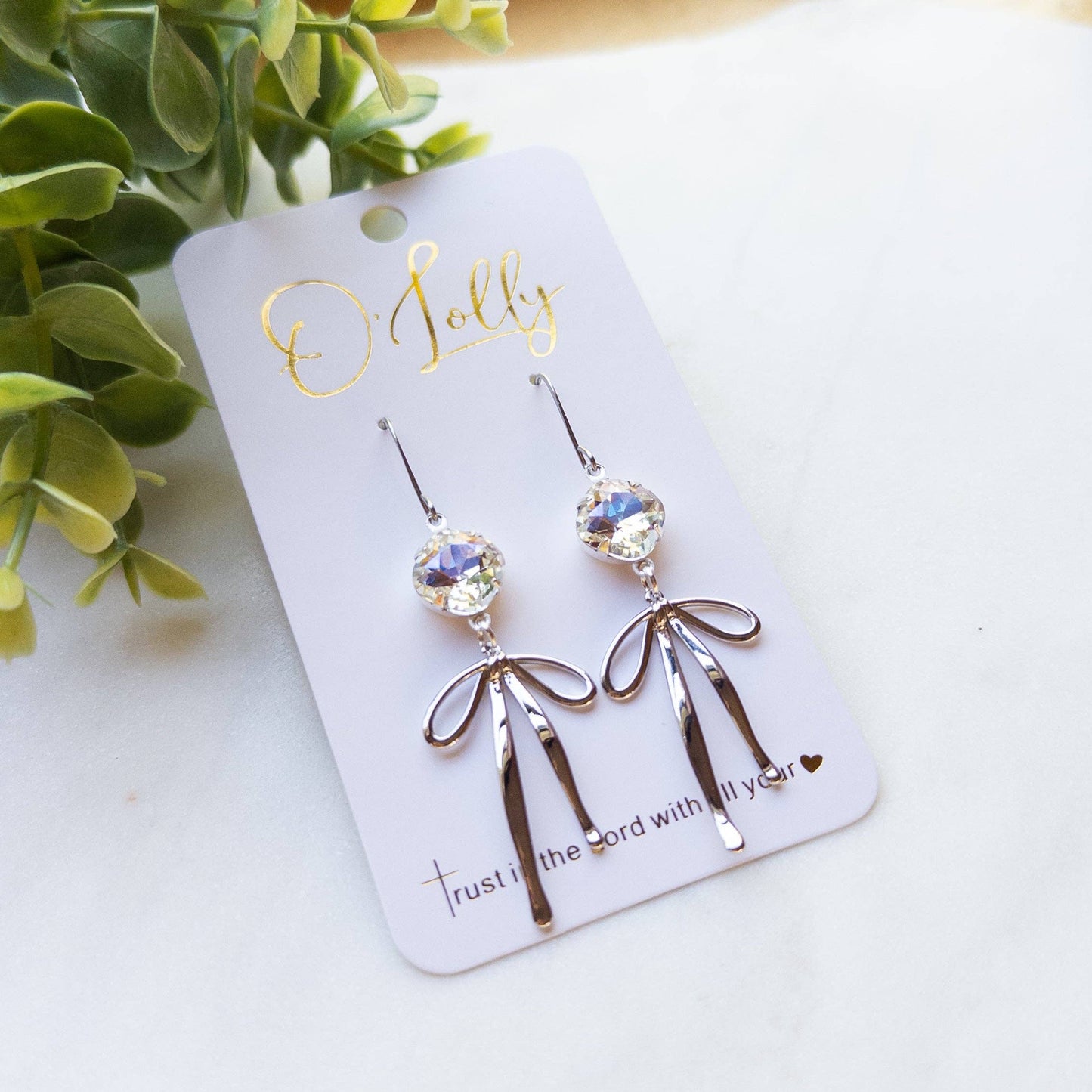 O’Lolly “Blakely” Earrings- Clear Stone w/Gold Bow Dangle: Silver