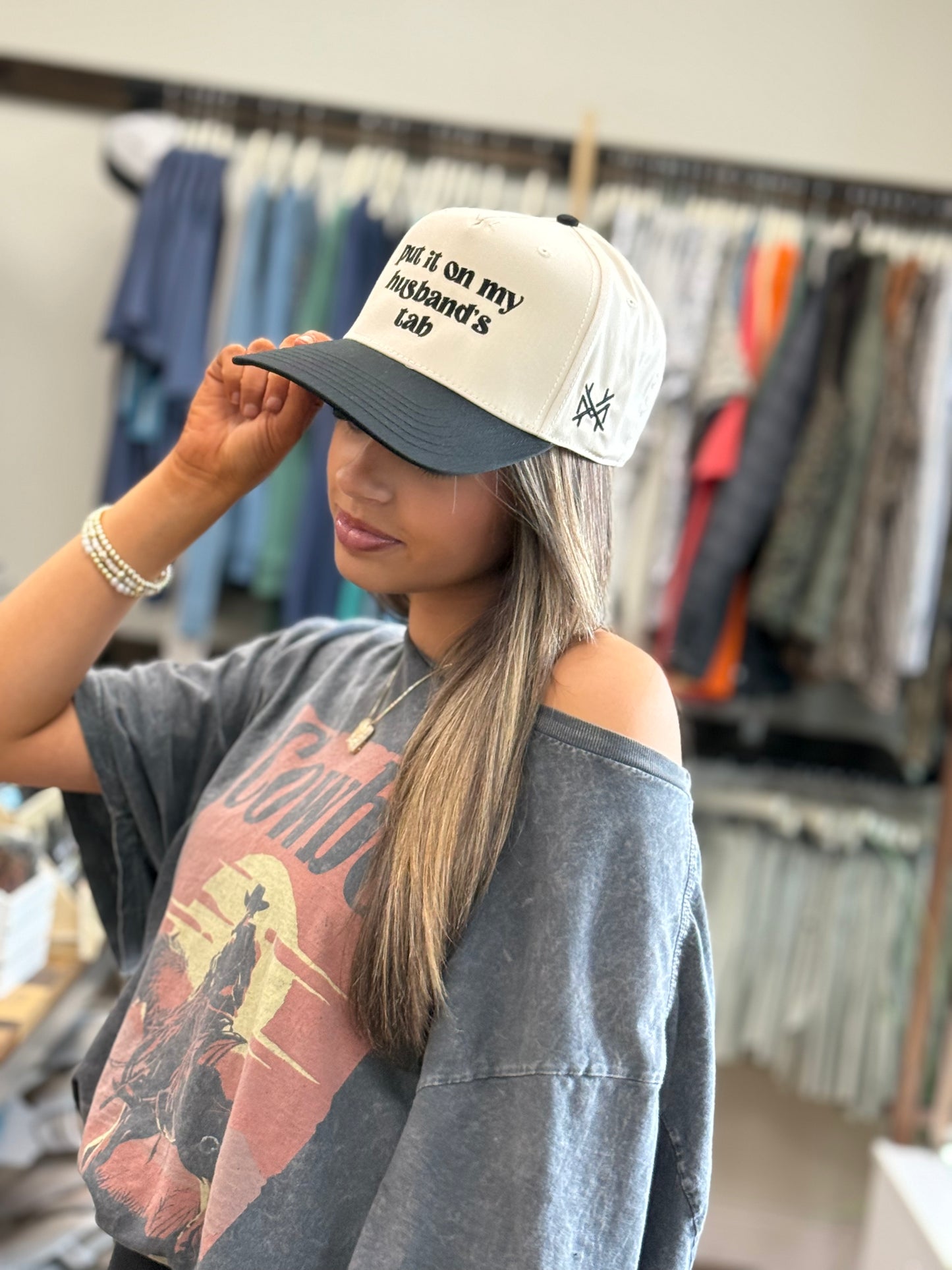 MHC Put it on my Husband's Tab Trucker Hat: Black/Natural Otto