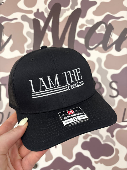 I Am The Problem Trucker Hat: Trucker Black
