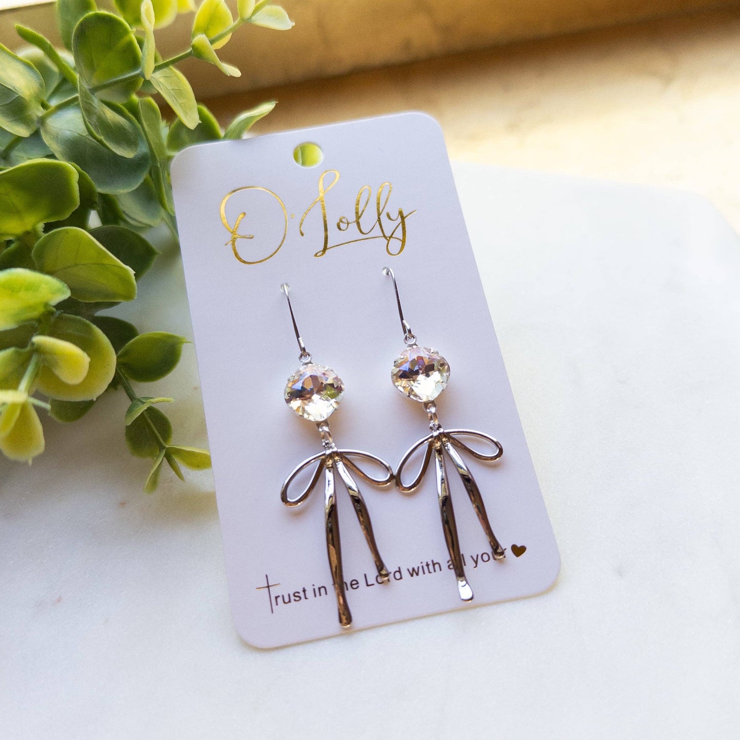 O’Lolly “Blakely” Earrings- Clear Stone w/Gold Bow Dangle: Yellow Gold