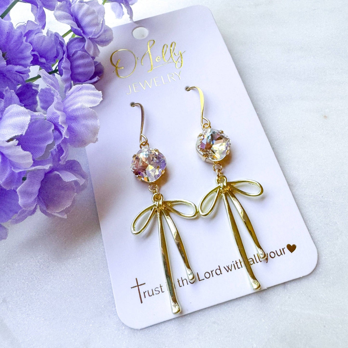 O’Lolly “Blakely” Earrings- Clear Stone w/Gold Bow Dangle: Silver